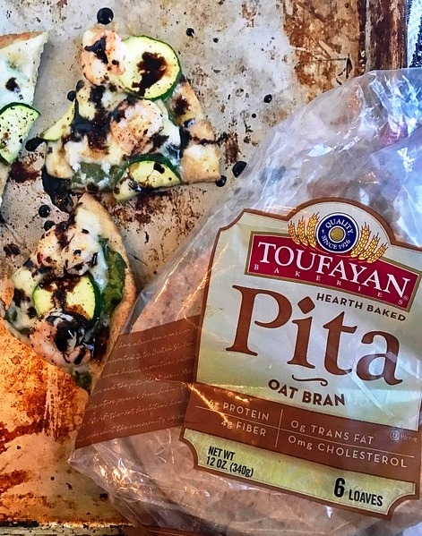 Mediterranean shrimp and zucchini pita pizza with balsamic glaze and bag of toufayan oat bran pita
