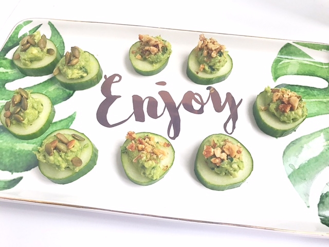 cucumber slices with guacamole and walnut appetizer