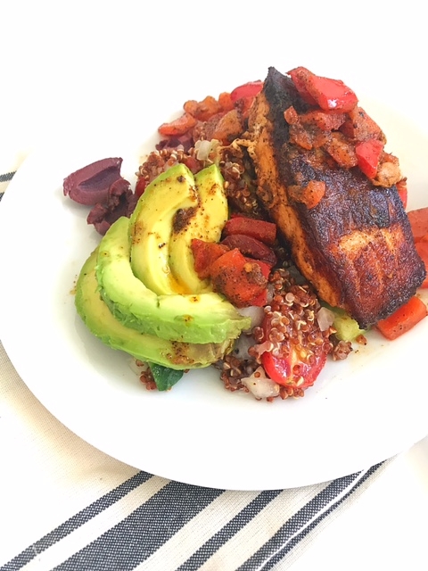 seared salmon with quinoa salad, red peppers and avocado