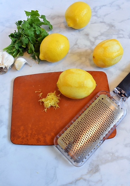 grating lemon zest with a microplane