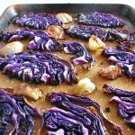 red cabbage and shallots on sheet pan