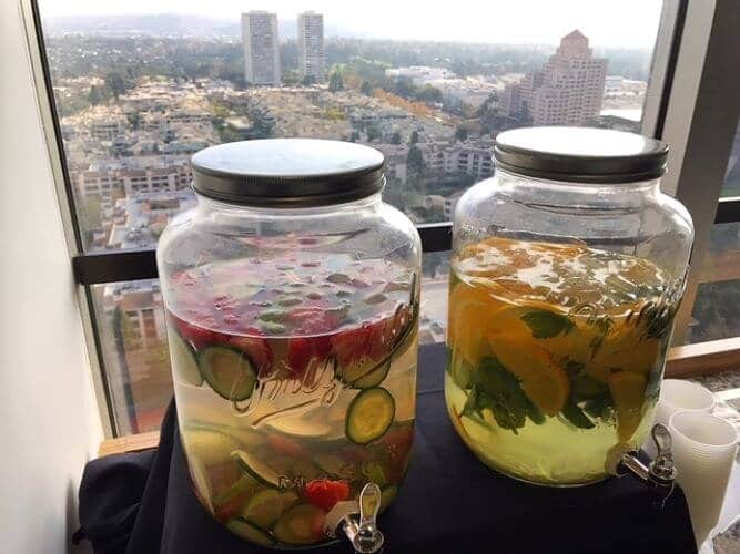 Lime, strawberry and cucumber fruit infused water and orange, ginger and mint infused water at corporate wellness event los angeles