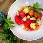 fruit salad with watermelon, cantaloupe, honeydew, fresh mint and orange blossom water