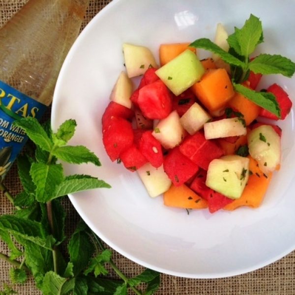 fruit salad with melon and fresh mint