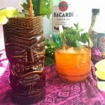 tiki mug and drink with rum bottle
