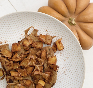 Cinnamon Apple French Toast on white plate next to decorative pumpkin
