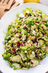 shaved brussels sprout salad on white platter
