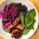 turkey meatballs in salad with spinach, red cabbage and blueberries