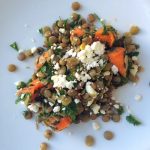 Lentil and Carrot Salad with Parsley, Cilantro, Mint and Feta on a white plate