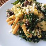 Chickpea Pasta with Roasted Veggies, Roasted Garlic Gremolata and Feta on a white plate
