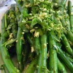 closeup of sauteed green beans with gremolata