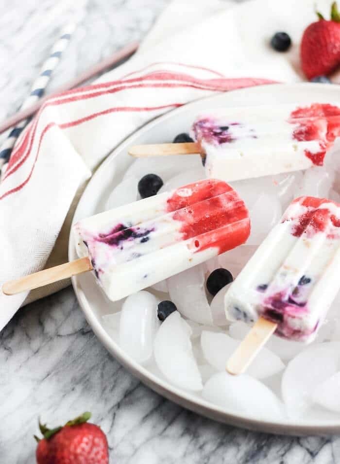 cheesecake pops with strawberries and blueberries