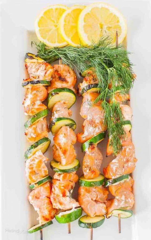 grilled salmon kabobs with zucchini slices, lemon and fresh dill