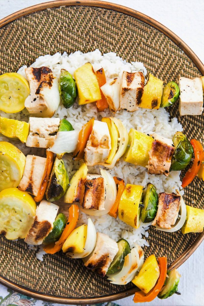 sesame ginger tofu kabobs with yellow squash onions and bell peppers