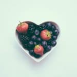 white heart ramekin with berries