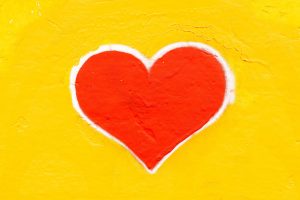 yellow background with red heart