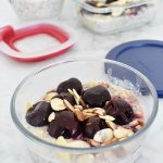 glass meal prep container with cherry vanilla almond overnight oats