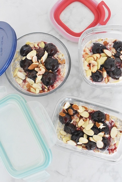 3 mismatched glass meal prep containers with cherry vanilla almond overnight oats