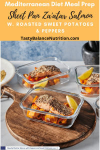 glass meal prep container with za'atar rubbed roasted salmon and slices of roasted sweet potatoes and red peppers