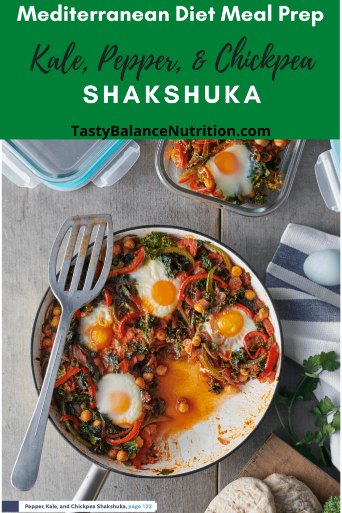 skillet and spatula with kale, pepper, and chickpea shakshuka