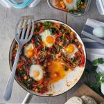 skillet with kale, pepper, and chickpea shakshuka